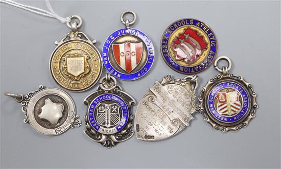 Six assorted early 20th century and later silver fob medals including enamel and football related and one other fob medal.